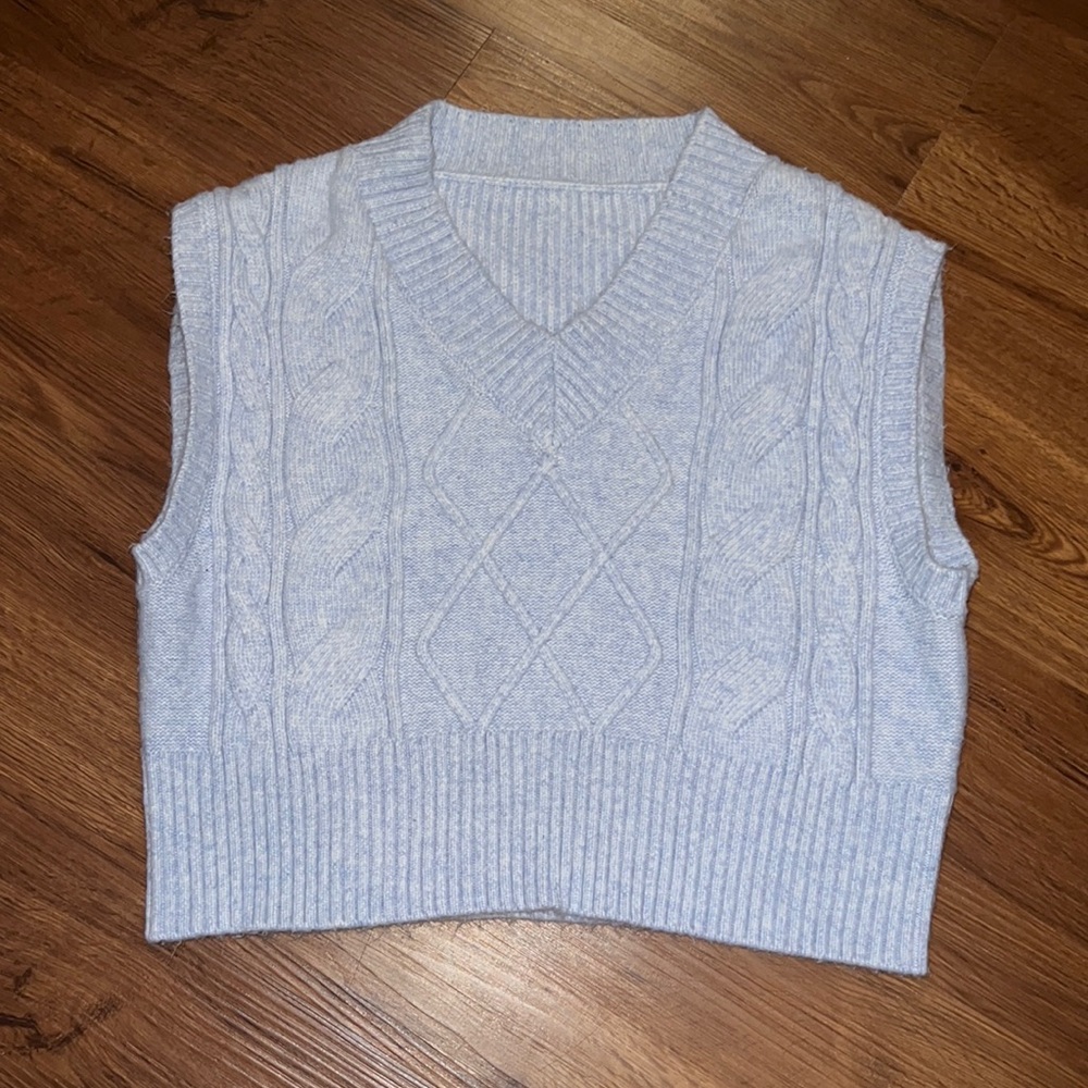 Brand is unknown, woman small cropped blue sweater.